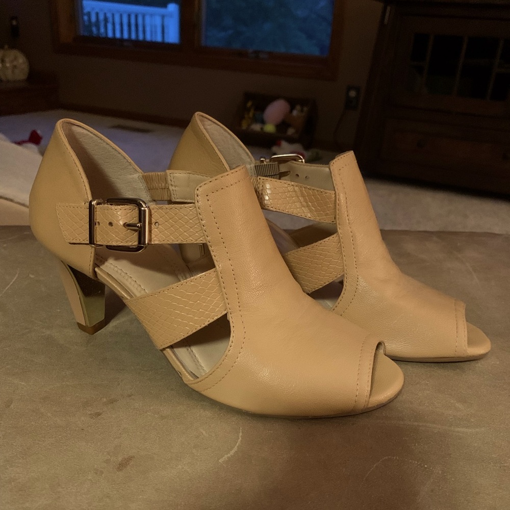 Buttery soft taupe heels by Nurture, the inside of the heel accented with gold.